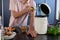 Midsection of biracial man cleaning waste in kitchen