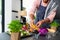 Midsection of biracial man wearing apron preparing meal with chopped vegetables in kitchen