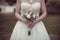 Midsection Of Bride Holding Bouquet