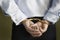 Midsection Of Businessman\'s Hands Cuffed Behind Back