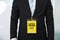 Midsection of businessman wearing backstage pass