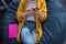 Midsection of businesswoman chilling in office relaxing space lying in beanbag using a smartphone