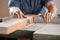 Midsection Of Carpenter Cutting Wood With Tablesaw