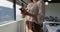 Midsection of caucasian businesswoman standing and using smartphone