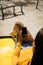 Midsection of caucasian woman lying on a beach buggy by the sea using smartphone