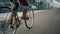 Midsection Close up leg shot of a businessman with bicycle commuting to the office. Modern building. Copyspace