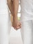 Midsection Of Couple Holding Hands