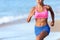Midsection Of Determined Woman Jogging On Beach