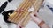 Midsection of diverse couple cleaning vegetable peelings in kitchen, slow motion