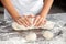Midsection Of Female Baker Kneading Dough