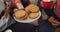 Midsection of group of diverse friends eating christmas cookies