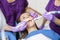 Midsection Of Mature Dentists Working On Young Female Patient\'s