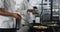 Midsection of mixed race male chef frying vegetables in pan