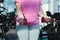 midsection of overweight woman with dumbbells