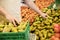 Midsection Of Salesman Arranging Fresh Pears