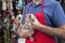 Midsection Of Salesman Holding Rabbit In Pet Store