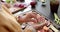 Midsection of senior caucasian woman cooking dinner in kitchen at home, slow motion