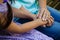 Midsection of senior woman holding hands of grandmother