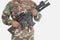 Midsection of US Marine Corps soldier holding M4 assault rifle over gray background