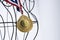 midsection of wire manniquin with golden medal