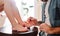 A midsection of young father painting small daugter`s nails in a bathroom at home.