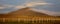 A midsummer night in Iceland. A mountain is glowing in the midnight sun.