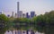 Midtown Manhattan skyline reflected from water of Central Park