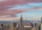 Midtown Manhattan at sunset, New York City. Panoramic aerial view of city skyscrapers at dusk