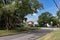 Midwest Neighborhood Street with Old Homes and Green Trees during the Summer in Lemont Illinois