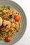 Mie goreng, fried yellow noodle prawn seafood vegetable tomato egg garlic shallot onion shrimp famous indonesian spicy dish.