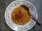 Mie goreng. Instant noodles. Fried noodles. Fried noodles are placed on a plate. Fried noodles from Indonesia. High angle view.