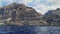The mighty cliffs of Los Gigantes of Tenerife viewed from a swaying boot