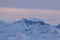 Mighty mountain ridge that is perfectly staged by the last rays of sun in the Swiss Alps.