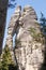 Mighty tall sandstone rock formation with name Lovers in nature tourism destination - Adrspach rock city, Czech Republic