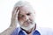 Migraine or memory loss illness senior man headache