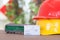 Migrant worker`s helmet, model train and a train ticket