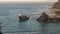 Migrating humpback whales surface on the california coast in big sur