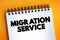 Migration Service text on notepad, concept background