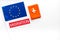 Migration to Europa concept. European flag near passport on white background top-down copy space