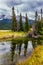 Miirror - lake. The valley along the Pocahontas road. The cloudy sky is reflected in the smooth water surface. The lakes, firs and