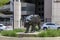 The Mike the Tiger Statue with lush green plants and trees at Tiger Stadium on the Campus of Louisiana State University