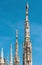 Milan Cathedral closeup, Italy. Detail of luxury roof. Famous Milan Cathedral or Duomo di Milano is a top landmark of Milan