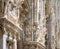 Milan Cathedral Duomo di Milano close-up, Milan, Italy. Detail of luxury facade with many marble statues and reliefs