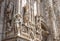 Milan Cathedral Duomo di Milano closeup, Milan, Italy. Detail of luxury facade with many marble statues and reliefs