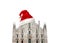 Milan Cathedral Italian: Duomo di Milano with Santa Claus hat isolated on white background