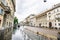 Milan. Corso Venezia Street in Milan. Walking Pedestrians and Car Traffic. Rainy Weather