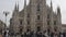 Milan Duomo Cathedral. People walking on Square Piazza Duomo di Milano.