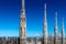 Milan Duomo spire detail in a sunny day and blue sky Milan city italy