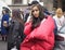 MILAN - FEBRUARY 22, 2018: Fashionable asian woman posing for photographers before GENNY fashion show, Milan Fashion Week 2018
