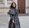 MILAN - FEBRUARY 25, 2018:Woman in SAN FEDELE square before MSGM fashion show, during Milan Fashion